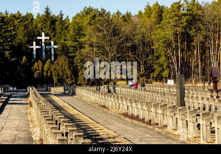 Palmiry, Poland - March 20, 2022: Historic cemetery of World War II victims from Warsaw and Mazovia executed by Hitler Nazis executed in Palmiry fores Stock Photo
