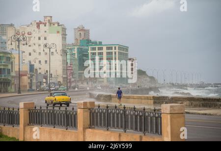 January 11, 2016 -- Havana, Cuba: A classic car drives along the Malecon in Havana.  (Liz Roll) Stock Photo