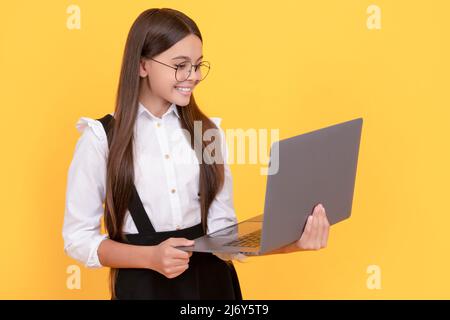 cheerful child study online. computer vision syndrome. nerd typing school blog. Stock Photo