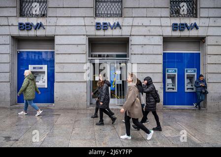 Pedestrians walk past the Spanish multinational Banco Bilbao Vizcaya Argentaria SA (BBVA) bank in Spain. Stock Photo