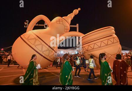 (220504) -- DOHA, May 4, 2022 (Xinhua) -- People take part in a giant balloon parade during the celebration of the Eid al-Fitr festival in Doha, Qatar, on May 4, 2022. (Photo by Nikku/Xinhua) Stock Photo