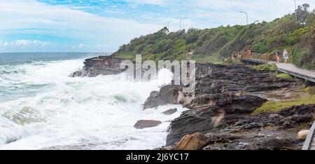 Big seas, due to an East Coast Low, (low pressure system) pound the rocky coastline and the Curl Curl (Beach) Boardwalk in Sydney, NSW, Australia Stock Photo