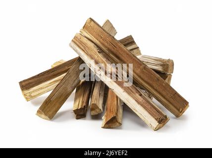 Stacks of firewood placed against a white background Stock Photo