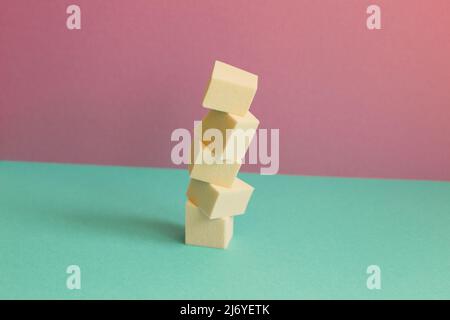 Stack of makeup sponge on mint green table. pink wall background Stock Photo