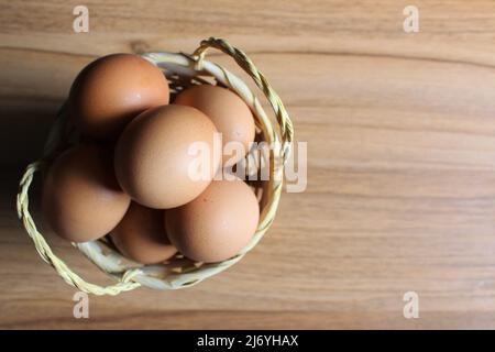 raw eggs in a basket Stock Photo