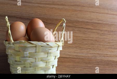 raw eggs in a basket Stock Photo