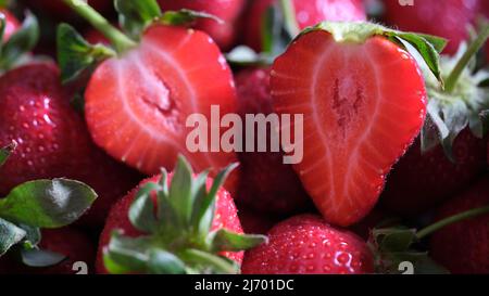 Delicious ripe sweet sliced strawberry closeup. Useful berries Stock Photo