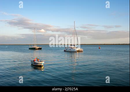 Boats moored at the harbor in front of Olhao, Algarve, Portugal, Europe Stock Photo