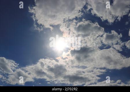 Sun and clouds in the sky, natural background. Stock Photo