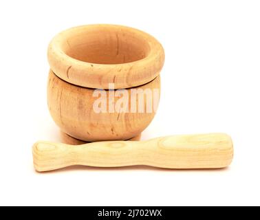 Small wooden mortar and pestle isolated on white background Stock Photo