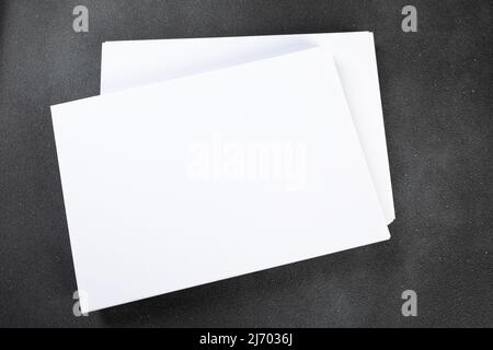 Blank a4 poster flyer isolated on gray to replace your mockup design Stock Photo