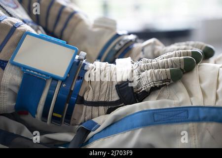 Astronaut space suit gloves close up detail Stock Photo