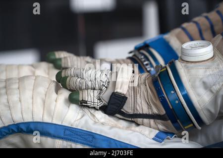 Astronaut space suit gloves close up detail Stock Photo