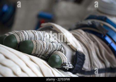 Astronaut space suit gloves close up detail Stock Photo