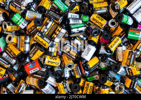 BERLIN - MAR 30: Heap of used old Kodak and many another film cartridges 35 mm at a photo store in Berlin, March 30. 2022 in Germany Stock Photo