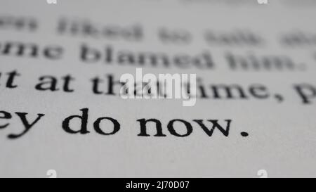 Do now text in open book page, selective focus, close up, macro shot of english message, education idea and novel concept, sitting view Stock Photo