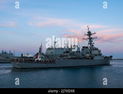 NAVAL STATION ROTA, Spain (April 27, 2022) – The Arleigh Burke-class guided-missile destroyer USS Arleigh Burke (DDG 51) pulls into port at Naval Station (NAVSTA) Rota, Spain after completing sea trials, April 27, 2022. Naval Station Rota sustains the fleet, enables the fighter and supports the family by conducting air operations, port operations, ensuring security and safety, assuring quality of life and providing the core services of power, water, fuel and information technology. (U.S. Navy photo by Mass Communication Specialist 2nd Class Jacob Owen) Stock Photo