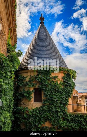 Olite, Spain - June 23, 2021: Tower of of the ornate gothic architecture of the palace of the Kings of Navarre or Royal Palace of Olite in Navarra Stock Photo