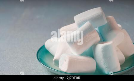 Pink ,white and blue marshmallows on a plate Stock Photo