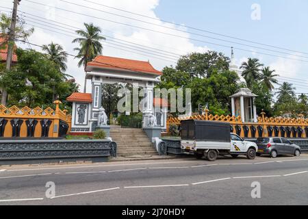 Malabe, Sri Lanka - December 4, 2021: Entrance to the Sri Sudharshanarama Purana Viharaya, main temple for Buddhists in Pittugala area Stock Photo