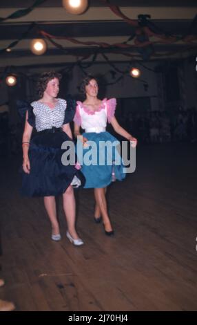 Two young women in dancing frocks c1968   Photo by Tony Henshaw Archive Stock Photo