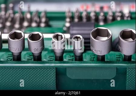 Interchangeable screwdriver set with different types of metal steel heads and bits, selective focus Stock Photo
