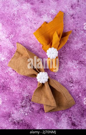 Linen napkin on lilac concrete background Stock Photo