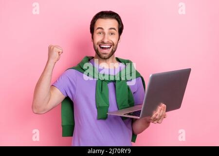 Photo of overjoyed delighted businessman working on new project signed contract isolated on pink color background Stock Photo