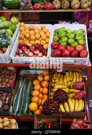 A close up of colourful fruit and vegetable stall at a local market Stock Photo
