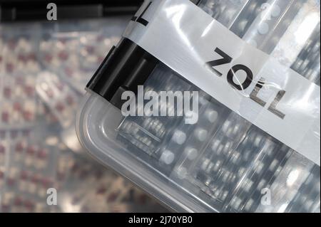 05 May 2022, Hessen, Frankfurt/Main: Pharmaceuticals seized by customs are presented during the annual press conference of the Frankfurt Main Customs Office at Frankfurt Airport. Photo: Sebastian Gollnow/dpa Stock Photo