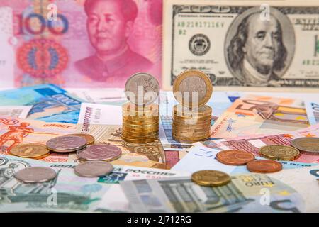 Rubles and euros against the background of yuan and dollars, close-up Stock Photo