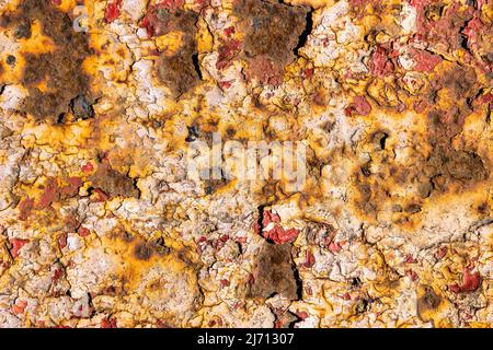 Rusty painted a metal background. Peeling paint texture Stock Photo