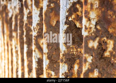 Rusty bridge railing texture background with cracked white paint Stock Photo