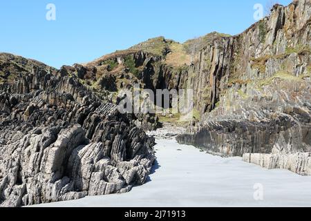 Sandy beach and entrance to Scoor Cave on the Isle of Mull in Scotland