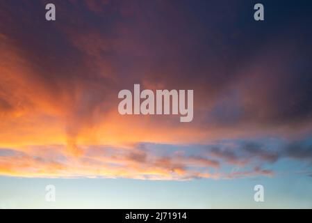 Dramatic sky with clouds at sunset, nature background Stock Photo