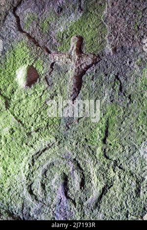 Prehistoric, early christian carvings and bronze cup markings in Scoor Cave on the Isle of Mull Stock Photo