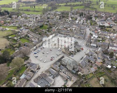 Masham, North Yorkshire, England, United Kingdom - April 4, 2022: Aerial photograph the small town of Masham in North Yorkshire featuring a large mark Stock Photo