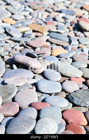 Coloured sea worn pebbles on a beach in Dumfries & Galloway, Scotland Stock Photo