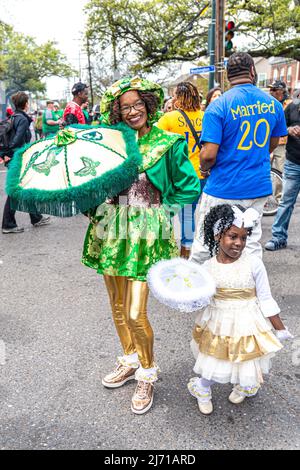 NEW ORLEANS, LA, USA - MARCH 17, 2019: Two generations of Baby Dolls marching and dance group assembled for Mardi Gras Indian parade on Super Sunday Stock Photo