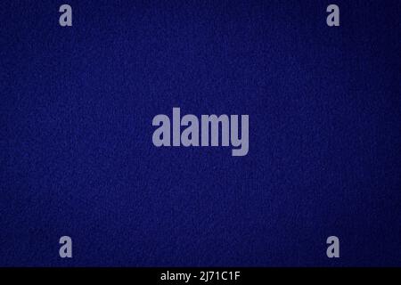 Navy blue color felt textile fabric material texture background. Abstract monochrome dark blue color felt background Stock Photo