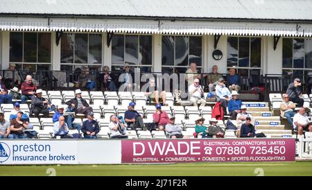 Hove UK 5th May 2022 - Spectators watch Sussex take on Middlesex on the first day of their LV= Insurance County Championship match at The 1st Central County Ground  in Hove . : Credit Simon Dack / Alamy Live News Stock Photo