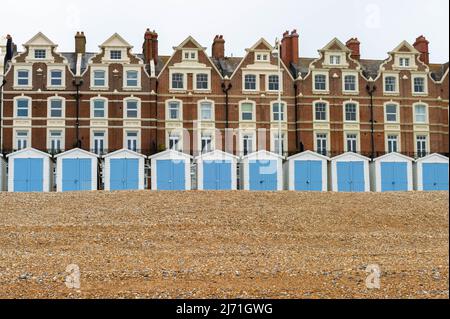 Dutch Inspired Gable Houses with Beach Huts in the Foreground on the sea front at Bexhill-on-Sea, East Sussex, England Stock Photo