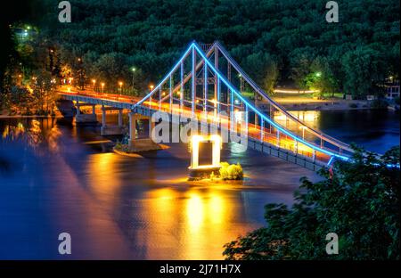 Beautiful night view of the Park bridge across the Dnieper in Kiev. Capital of Ukraine - Kyiv. Stock Photo