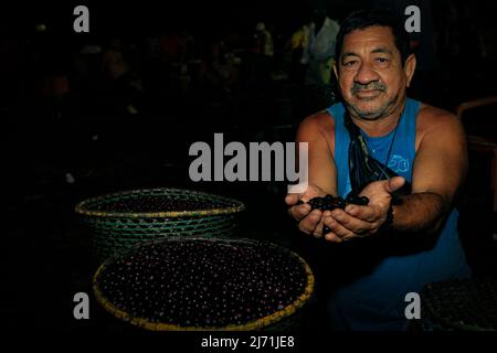 Market vendor selling açaí at  Ver-o-Peso street market in Belém do Pará, Amazon, Brazil. 2014. Stock Photo