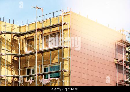 External wall insulation during spring season. Solid wall insulation. Energy efficiency house wall renovation for energy saving. Stock Photo