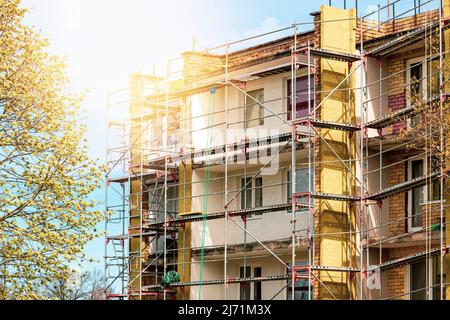 External wall insulation during spring season. Solid wall insulation. Energy efficiency house wall renovation for energy saving. Stock Photo