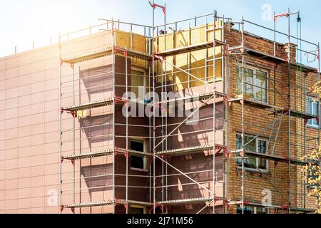 External wall insulation during spring season. Solid wall insulation. Energy efficiency house wall renovation for energy saving. Stock Photo