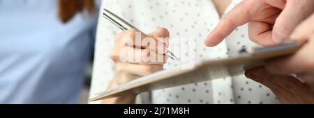 Close-up of smart people working in big modern office with smart manager. Stock Photo