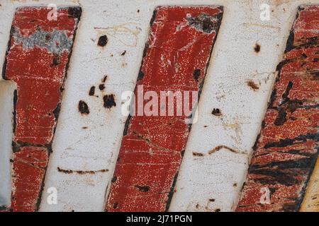 Rusty metal texture with red stripes. Abstract background. Stock Photo