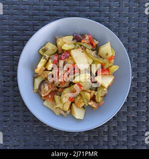 Mixed vegetables oven roasted potatoes zucchini aubergine peppers and onions. Briami vegetarian greek food mediterranean cuisine. Stock Photo